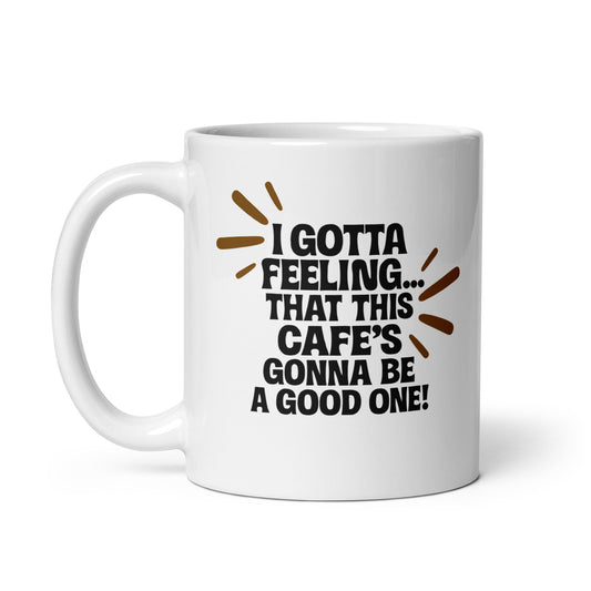 Taza con frase “I gotta feeling... that this cafe's gonna be a good one!” para fans del pop